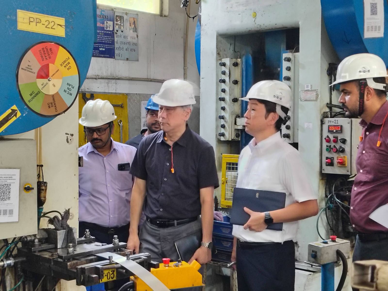 NS Instruments team from Japan reviewing a press line at G.K. Industries